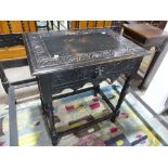 A late 19thC stained oak Side Table, with heavily carved top upon central drawer boasting Green