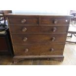 A Georgian oak Chest of Drawers, the two short above three long graduated in size, with turned oak