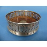 A commemorative Millennium silver Bottle Coaster, by W I Broadway & Co., hallmarked Birmingham,