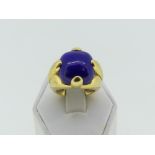A large and heavy Lapis Lazuli Ring, the central square stone mounted in exaggerated claws and thick