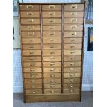 An early 20thC oak industrial Card Index Chest, the three quarter gallery upon the forty-five