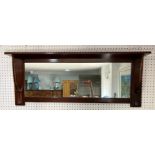 An Edwardian Arts & Crafts 'Liberty' walnut overmantle Mirror, of rectangular form with plate-