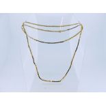 An 18ct yellow gold Snake Chain, 27in (69cm) long, approx total weight 11.8g.