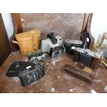 Four vintage Cameras, including a Polaroid Singer II Land Camera, an Agfa Isolette and a