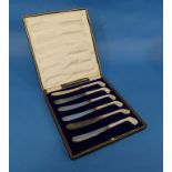 Golf Interest; An early 20thC cased set of six silver plated Butter Knives, with mother of pearl