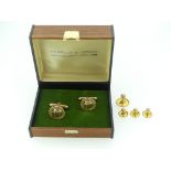 A pair of 9ct gold Cufflinks, the pierced fronts with 'Afrox 10' inside a laurel leaf surround,