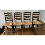 A set of four early 20thC oak Ladder-back Chairs, the laddered back over the envelope rush seats,