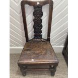 A late 18th century elm and oak side Chair, with foliate carved splat above a board set, on turned