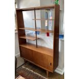 A retro teak Room Divider, the upper half with open shelving of varying sizes upon a two sliding