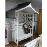 A vintage white painted wooden garden Arbour, 90in (228.5cm) high x 66in (167.5cm) wide x 40in (