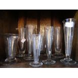 A collection of eight early 20thC Chemist Measuring Glasses, the tallest 6¾in (17.5cm) (8)