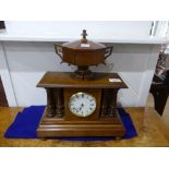 An Edwardian walnut cased Mantel Clock, of columned architectural form, the case surmounted by a