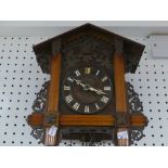 An early 20th century Black Forest Cuckoo Clock, with pendulum and two weights, the case 12½in (