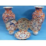 A pair of Japanese imari porcelain Vases, of spiral fluted baluster form, 15in (38cm) high, together