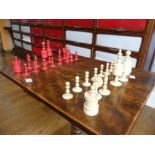 A 19thC ivory Chess Set, with natural coloured and red stained pieces, King 4in (10cm) high,