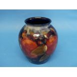 A Walter Moorcroft 'Pomegranate' pattern Vase, the tube-lined design, with impressed marks and