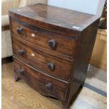 A small Georgian mahogany bow front Chest of Drawers, with three long drawers, knob handles and
