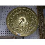An Arts and Crafts circular Brass Wall Clock, in the manner of Margaret Gilmour, Glasgow School,