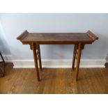 An early 20thC Chinese Alter Table, with scroll ends, splayed circular supports, united by a
