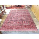 Tribal rugs; an old Turkmen, possibly Ersari, red ground rug, finely woven and hand knotted with