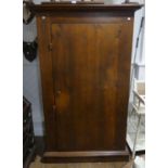 An antique-style Cupboard, made of stained reclaimed timber, the door with metal studwork