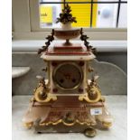 A French pink onyx and gilt metal mantel Clock, with transfer decoration and mounted with floral