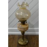 A late Victorian brass and glass Oil Lamp, of fluted column form with marbled glass reservoir,