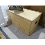 An early 20th century pine Blanket Box, with hinged lid and two carry handles, 37in (94cm) wide x