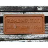 A vintage Brannam Pottery terracotta Advertising Plaque, 20in wide x 10in high (51cm x 25.5cm).