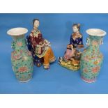 A pair of early 20th century Chinese famille rose porcelain Vases, green ground, applied with fu
