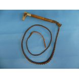 An early 20thC Beagle Hunting Whip, with malacca shaft and carved antler handle in the form of a