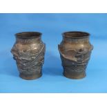 A pair of late 19thC oriental bronze baluster Vases, each moulded in relief in the Japanese style