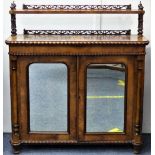 An Edwardian walnut Chiffonier, the half veneered top with piered gallery behind, below raised shelf