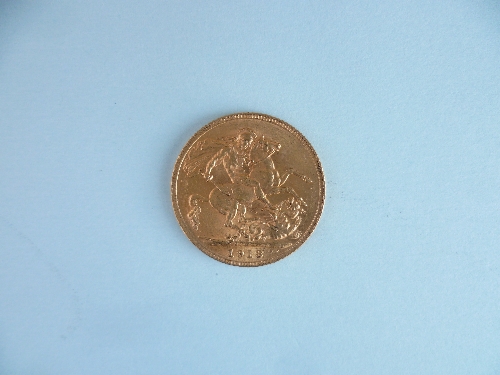 A George V gold Sovereign, dated 1913.