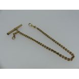 A short 15ct gold Watch Chain, with 9ct gold clip and gilt metal T-Bar, approx total weight 14g.