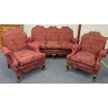 An antique-style Three-piece Suite, the mahogany framed enclosing the sofa and two arm chairs, all