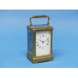 An early 20th century French gilt-brass striking Carriage Clock, of five-glass form with carry