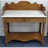 An early 20thC marble-topped Washstand, the oak shaped three-quarter gallery on marble top above two