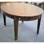 An Edwardian mahogany Georgian-style oval extending Dining Table, the extending top with extra leaf,