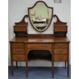 An Edwardian mahogany and inlaid Maple & Co Dressing Table, the central shield-shaped bevelled plate