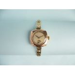 A 9ct gold lady's Wristwatch, with Swiss movement, the square case with circular silvered dial,