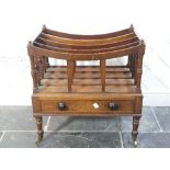 A Victorian mahogany Canterbury, of typical form, the five slatted dividers upon one frieze