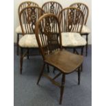 A set of six early 20thC ash and elm Wheelback Dining Chairs, the hooped back enclosing stick