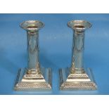 A pair of Edwardian silver Candlesticks, by Thomas Bradbury & Sons Ltd., hallmarked Sheffield, 1901,