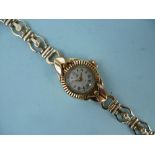 A lady's Rotary gold plated Wristwatch, on a 9ct gold open link bracelet, gross total weight 12g.