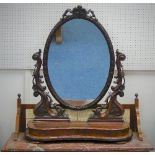 A 19thC mahogany framed Dressing Table Mirror, the oval plate enclosed in moulded frame with central
