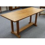 An early 20thC oak Refrectory Table, the oak top upon four square supports froming the trestle base,