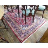 Tribal Rugs; a hand-knotted wool Persian carpet, red ground with blue border and central