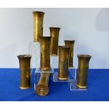 A set of eight Arts and Crafts Keswick School brass Beakers, the hammered surround in fluted form,