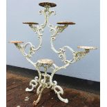 Garden Furniture; a Victorian white painted scrolling cast iron six tier Plant Stand, 42¾in high x